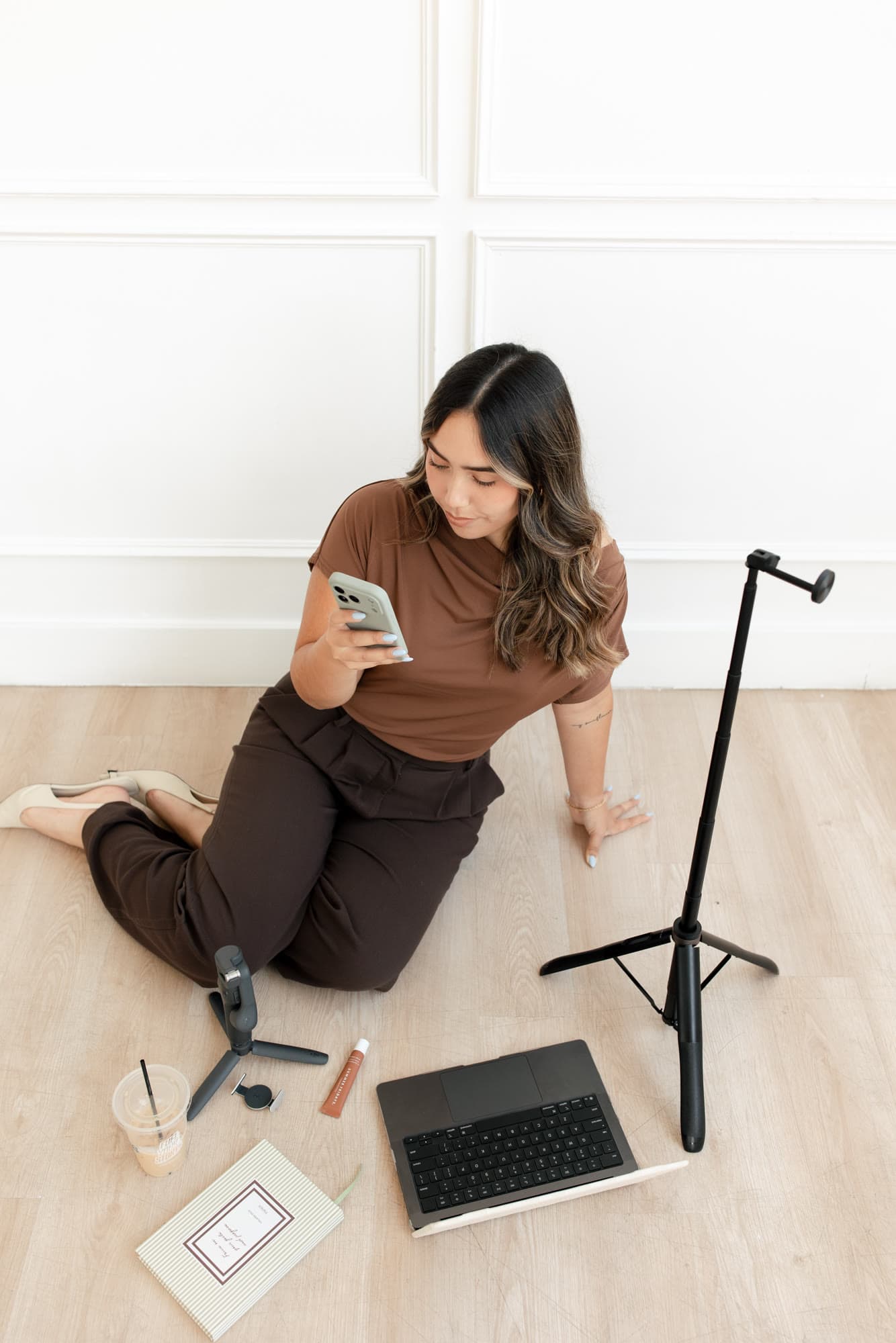 Overhead portrait of Valeria seated with her studio tools
